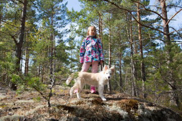 Girl and a puppy in the forest - Pixbuster Free Images